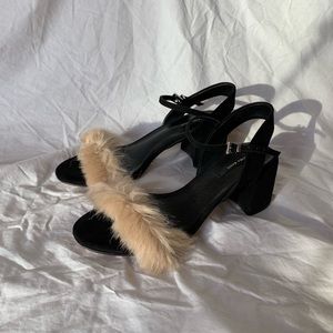 Cute black heels with pinkish puff on the front
